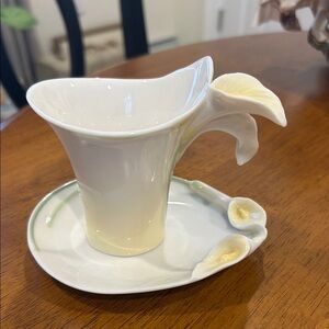 Franz Calla Lilly 
Elegant White and Cream Floral Teacup and Saucer